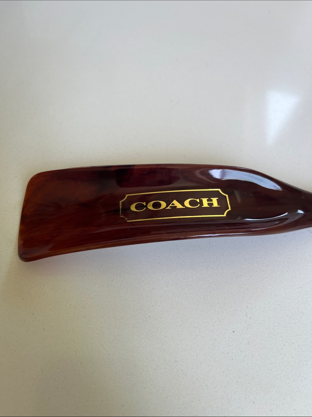 COACH Tortoiseshell-Style Shoe Horn with Gold Logo - Picture 2 of 3